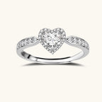 Complete jewelry set with heart-shaped sterling silver pieces featuring brilliant moissanite stones on white background.