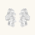 Modern sculptural jewelry set with flowing ribbon-like earrings and matching pendant in eco-zinc alloy finish