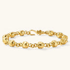 24K gold plated sterling silver bracelet with polished skull beads on a rolo chain link, hook-and-eye clasp, 200mm length.