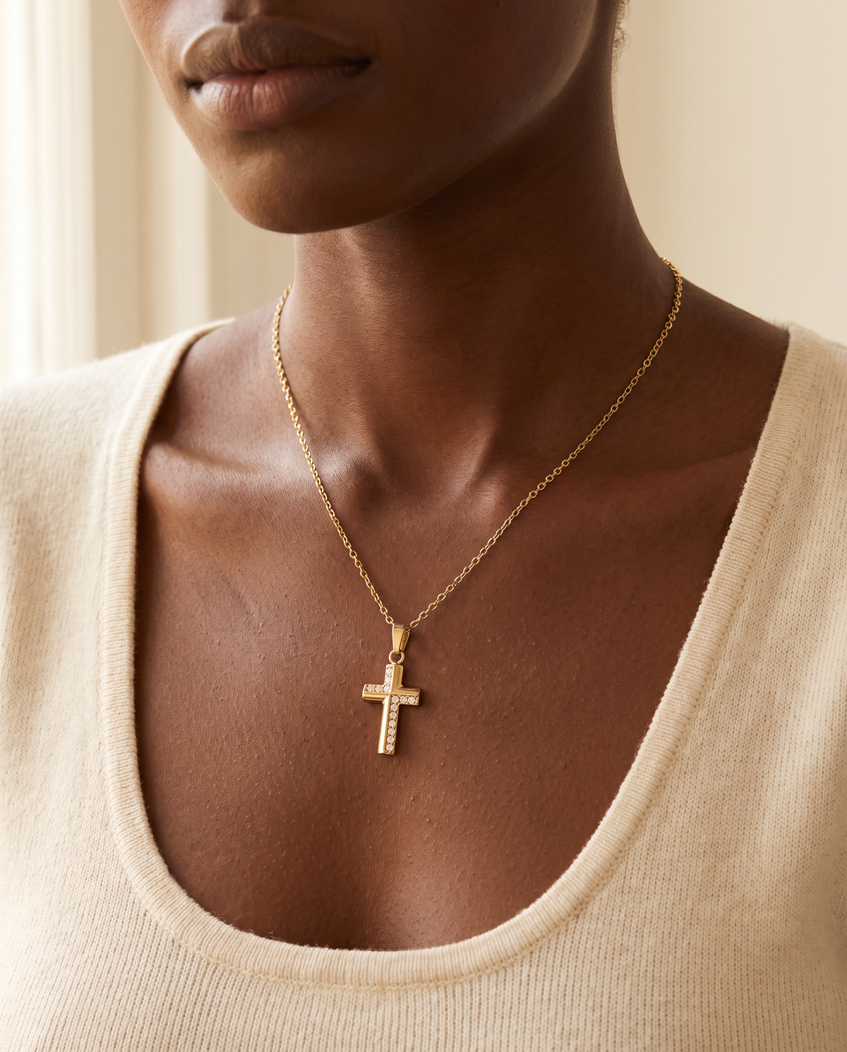 Woman wearing the Divine Radiance Cross Necklace, pavé crystal gold cross